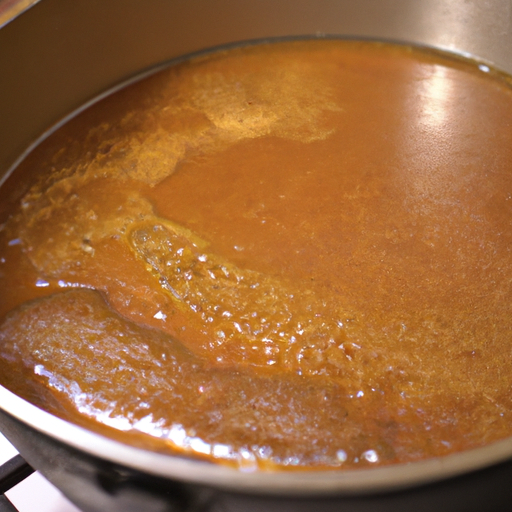 A Dutch oven being seasoned with a thin layer of vegetable oil.